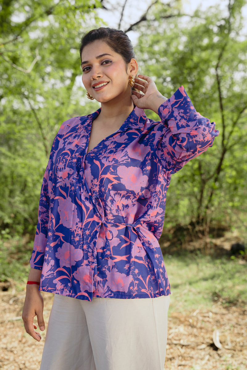 Female model wearing a purple electric violet casual wear wrap top by 22twelve