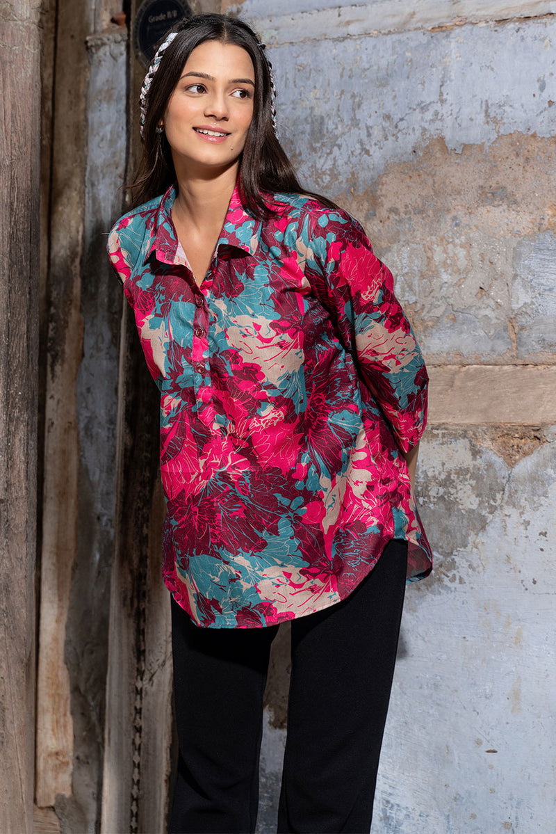 Female model wearing a burgundy pink abstract floral casual wear top by 22twelve